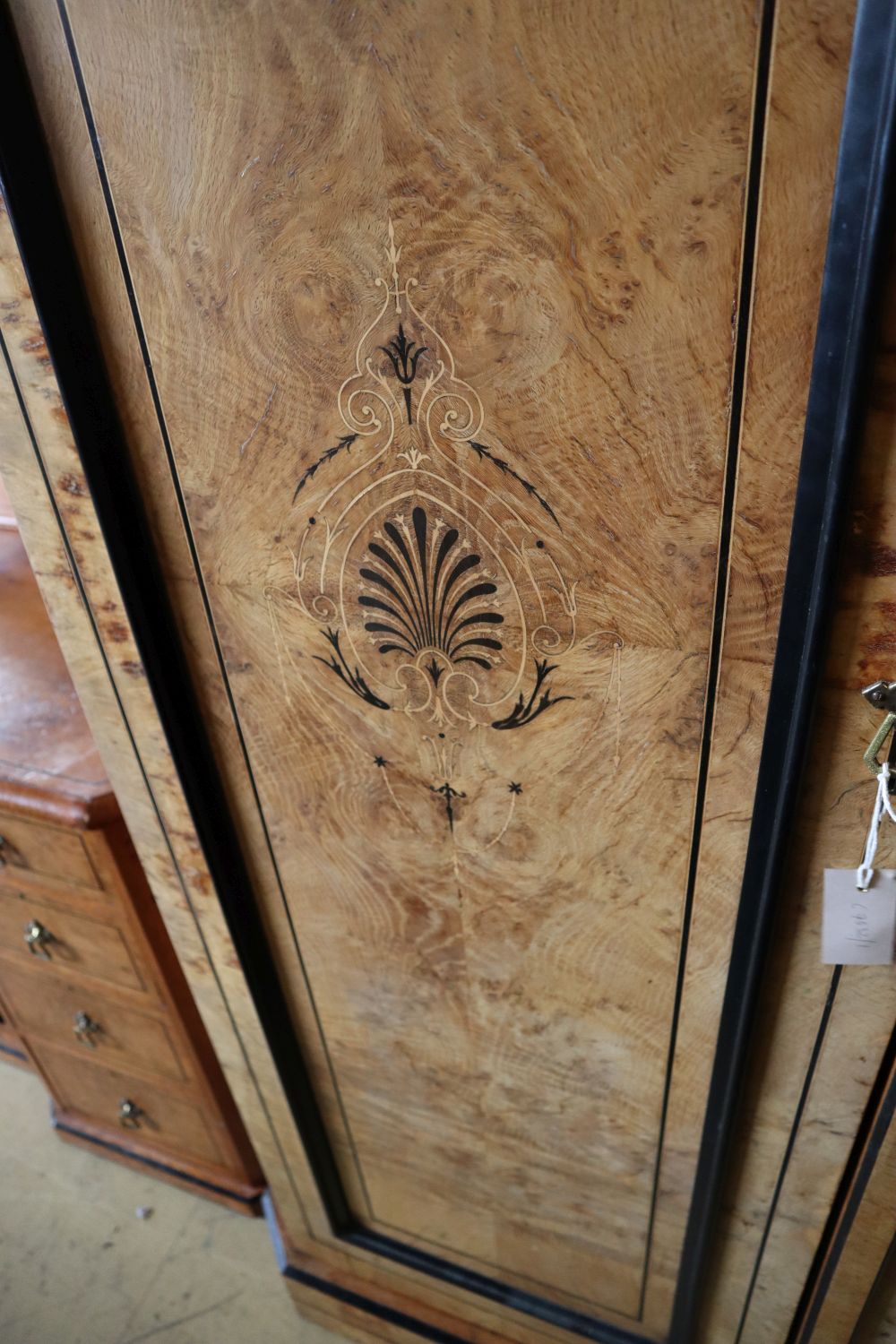 A late Victorian inlaid burr oak triple wardrobe, width 220cm depth 68cm height 221cm